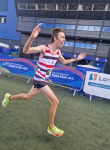 Aidan Elmore celebrating at Ipswich half 2025